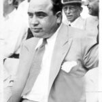 Al Capone watching baseball, with scars on view