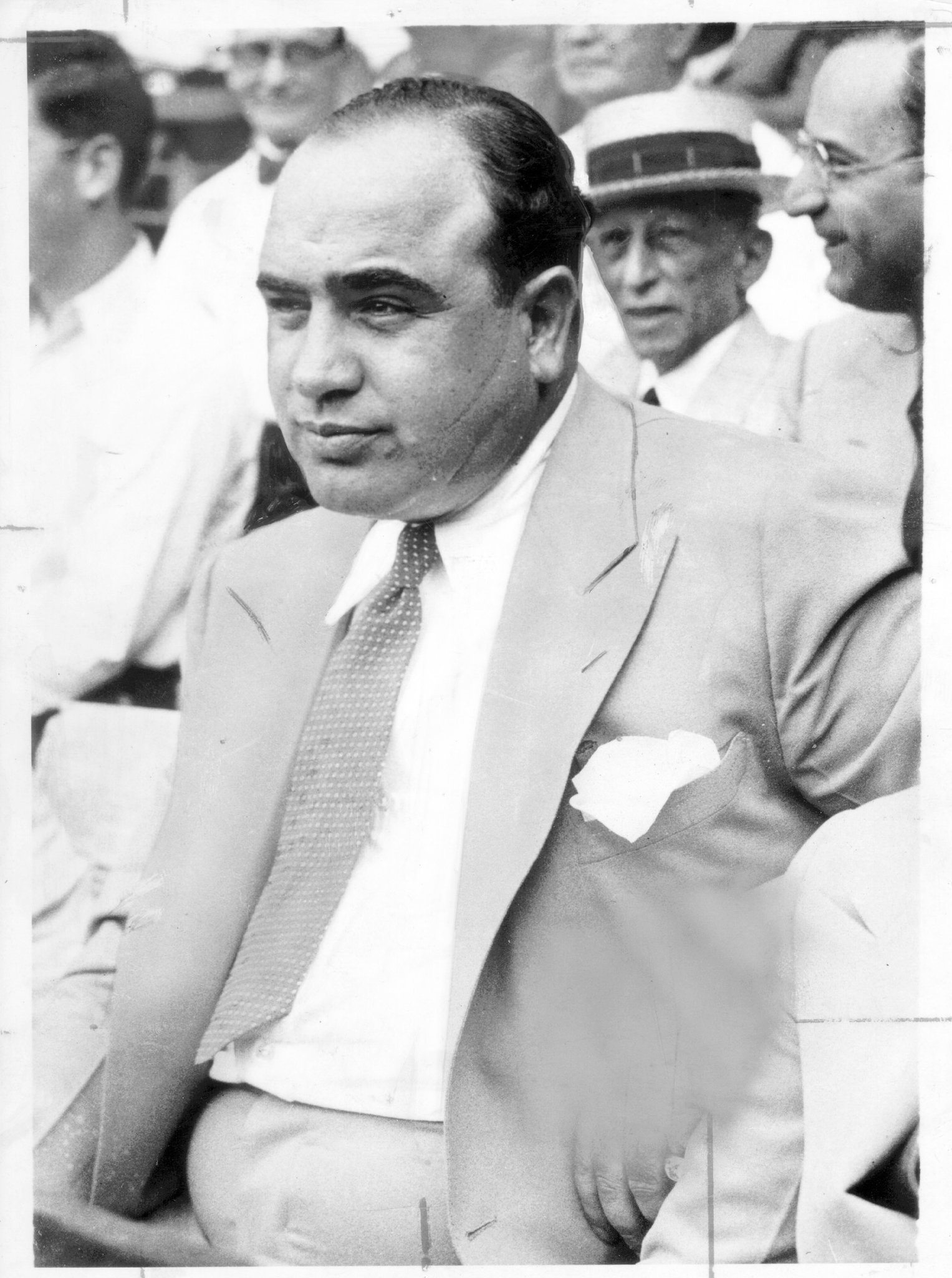 Al Capone watching baseball, with scars on view